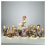 (13pc) Hummels Small & Medium | Small and medium Hummels, including children with umbrella, “Which H