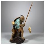 Chinese Fishing Figure | Porcelain statue of barefoot man with hat and beard with caught fish. Marke