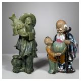 (2pc) Chinese Statues | Two Chinese figures including a carved stone man carrying fish, and an elder