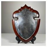 Japanese Silver Shield Crest | Likely silver plate, on a wood backing, with wire for hanging; with B