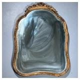 Gold Gilt Mirror | A very heavy mirror in a shaped carved wood frame. - h. 35.5 x w. 25.5 in