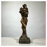 AMOUROUS COUPLE PLASTER SCULPTURE | Faux bronzed sculpture of a couple embracing. - h. 23 in