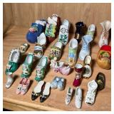 LIMOGES & OTHER SHOE FIGURES | Large mixed lot of mostly porcelain and other shoe figurines, includi