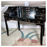 Chinoiserie Lacquered Desk | Black lacquered harpsichord style writing desk of curved shape, the top