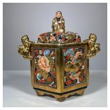 Japanese Porcelain Censer | Elaborately decorated gilt porcelain box with lion-form handles, the lid