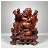 Carved Wood Buddha | Wooden laughing Buddha figure with bodhisattvas, continuously carved into a woo
