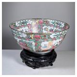Famille Rose Bowl | Famille Rose porcelain center bowl decorated in Hong Kong, on a carved wood stan