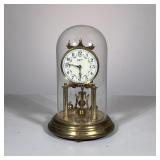 JOHN WANAMAKER GLASS DOME CLOCK | John Wanamaker brass & glass dome clock with painted enamel face, 