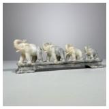 Carved Stone Elephant Group | Four elephants of graduated size on a stand (attached) - h. 3 x w. 9.2