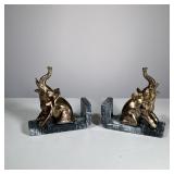 BRASS & MARBLE ELEPHANT BOOKENDS | Brass elephant figurine bookends on a marble base, no apparent ma
