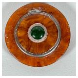 Art Deco Jade Compact | An unusual bakelite disc-form compact with a central inset jade cabochon. - 