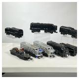 (8pc) LIONEL LOCOMOTIVES & COAL CARS | Including two silver locomotives, two black locomotives, thre
