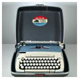 VINTAGE SMITH CORONA TYPEWRITER | Portable electric typewriter in carrying case.