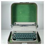 VINTAGE REMINGTON MECHANICAL TYPEWRITER | In a green-lined carrying case, with green keyboard