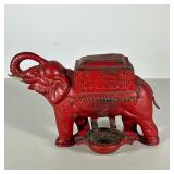 Cast Iron Cigarette Dispenser | Red cast iron elephant-form cigarette box and holder with turning di