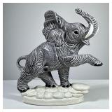 CERAMIC ELEPHANT FIGURE | A glazed ceramic elephant figure, with impressed numeral markers to unders