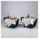 (2pc) Judaica Teapots | Teapots made by Tony Carter in England, one depicts a Sedar dinner, the othe