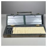 Rummikub Set | Gray corduroy carrying case. - h. 5 x w. 3.5 x l. 14 in