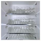 Cabinet of Barware | A large collection of mostly Arcoroc Stemware Glasses, including wine glasses, 