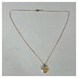 18K GOLD NECKLACE | Designed as an 18K gold necklace with heart-shaped opaline glass pendant with en