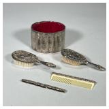 (5pc) SILVER PLATE BRUSHES & COMBS | Including: pair of engraved silver plate brushes, pair of toole