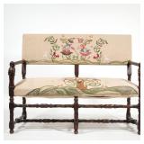 ACOBEAN FIGURAL CARVED SETTEE | Each hand hold carved with a full figure grasping a flower, the fram
