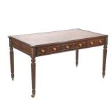 A VERY FINE REGENCY MAHOGANY DESK WITH LEATHER TOP | Having a stitched and gilt decorated inset leat