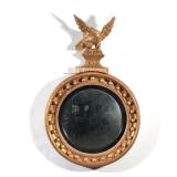 DIMINUTIVE EAGLE CONVEX MIRROR | Gilt carved eagle finial over gilt convex mirror.