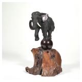JAPANESE BRONZE ELEPHANT | Possibly Meiji period, on a wood base h. 13 x w. 7 x l. 10 in.