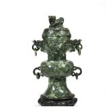 CHINESE CARVED JADE COVERED VASE |Having carved dragon mounts with ring carvings on carved wood base