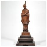 "YASHA HEIFETZ CARVED FIGURAL TABLE LAMP | A carved wood female figure in robe with fan on a tiered 