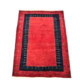 PERSIAN GABBEH WOOL RUG | With a blue border on a dark red ground - w. 41 x l. 58.5 in.