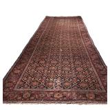 ANTIQUE KARABAGH CARPET | flat woven large runner with an overall pattern in red and beige over a bl