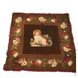 ANTIQUE NEEDLEPOINT / HOOKED RUG | with an applied needlepoint panel depicting a King Charles spanie