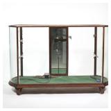 "LILLIPUTIAN BAZAAR" GLASS DISPLAY CASE | glass top, convex curved glass sides, and a glass front wi