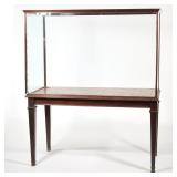 F. SAGE & CO. LTD. LONDON, DISPLAY CABINET WITH TABLE BASE | Having three glass sides and a glass to