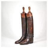 "RIDING BOOTS & BOOT FORMS | A pair of dark brown leather riding boots and wooden boot forms h. 26 x
