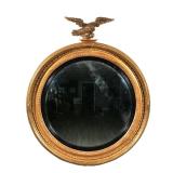 "19TH CENTURY GILT EAGLE CONVEX MIRROR | Of impressive and desirable size, crested by a gilt carved 