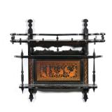 "BLACK PAINTED WALL SHELF | Two tiered wall shelf, the upper section with three quarter gallery, wit