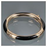 14K GOLD & ONYX HARD BRACELET | Designed as a 14K gold and carved onyx bangle bracelet, marked "585 