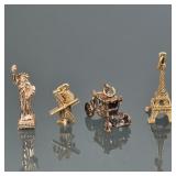 "(4pc) 14K & 10K GOLD CHARMS | Including three finely cast 14k gold charms; a Statue of Liberty gold