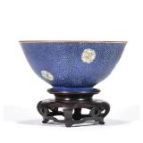 "CHINESE PORCELAIN BOWL | The sculpted exterior decorated with famille rose medallions on a cobalt g