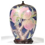 "CHINESE GINGER JAR LAMP | Decorated with peaches and blossoming branches and bats over a blue groun
