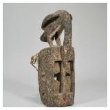 "CARVED AFRICAN MASK | Carved wood & painted African mask crested by a bird with rope net backing h.