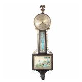 "INGRAHAM TREASURE ISLAND BANJO CLOCK | In a walnut case, silvered dial with Arabic numerals, with r
