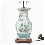 "CHINESE FAMILLE ROSE VASE | Porcelain enamel decorated vase mounted on a wood scroll-footed stand a