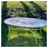 Outdoor Patio Table | Oval top patio table with umbrella, table by Tropitone. - h. 26.5 x w. 47.5 x 