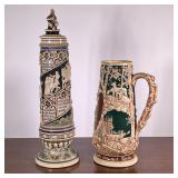(2pc) Large German Steins | German steins both numbered. One has lid and writing and the other depic