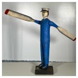Wooden Captain Whirligig | Boat Captain dressed in blue windmill holding paddles that rotate with wi