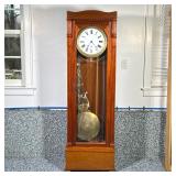 TALL CASE CLOCK | Contemporary tall case clock on base with large pendulum. Dimensions: h. 72 x w. 2